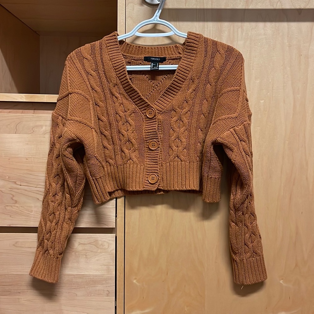 Cropped cable knit sweater